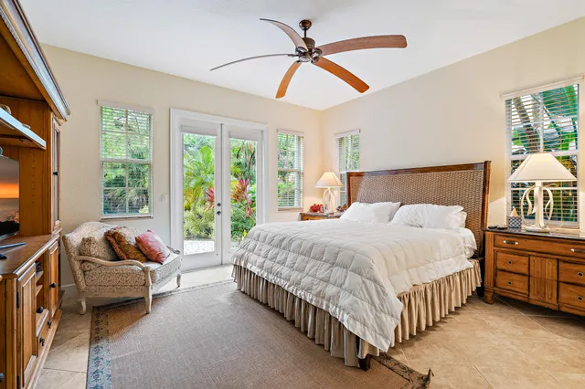 a living room with furniture and a lamp
