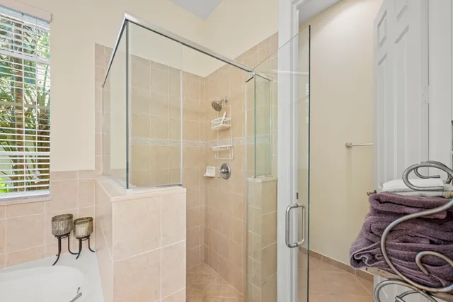 a bedroom with a bed and a lamp