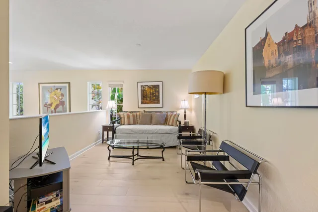 a view of a room that has a large window