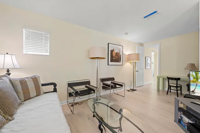 a bedroom with a bed and a lamp on table