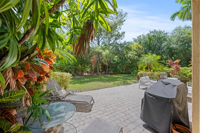 a view of backyard with outdoor seating ad green space