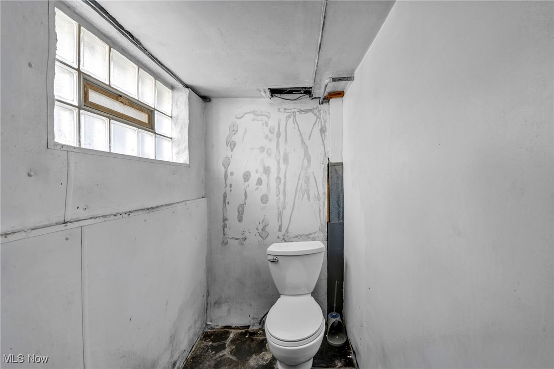 1743 Clarkstone Road Cleveland, OH 44112 - Photo 24 of 24 Unfinished basement bathroom with toilet