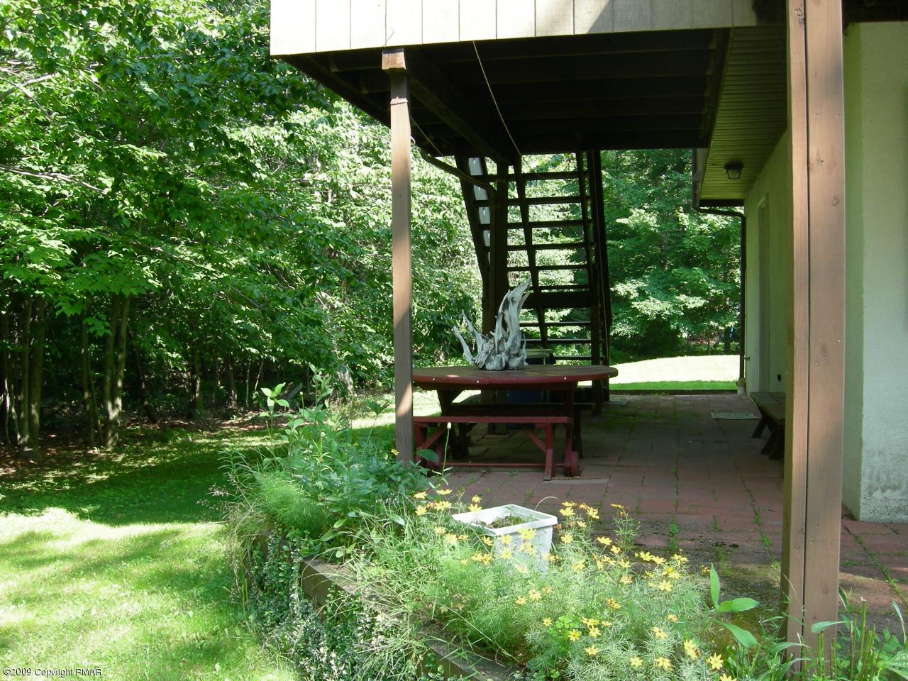 1115 Kilmer Road Tobyhanna, PA 18466 - Photo 3 of 17 a view of a bench in the middle of a park