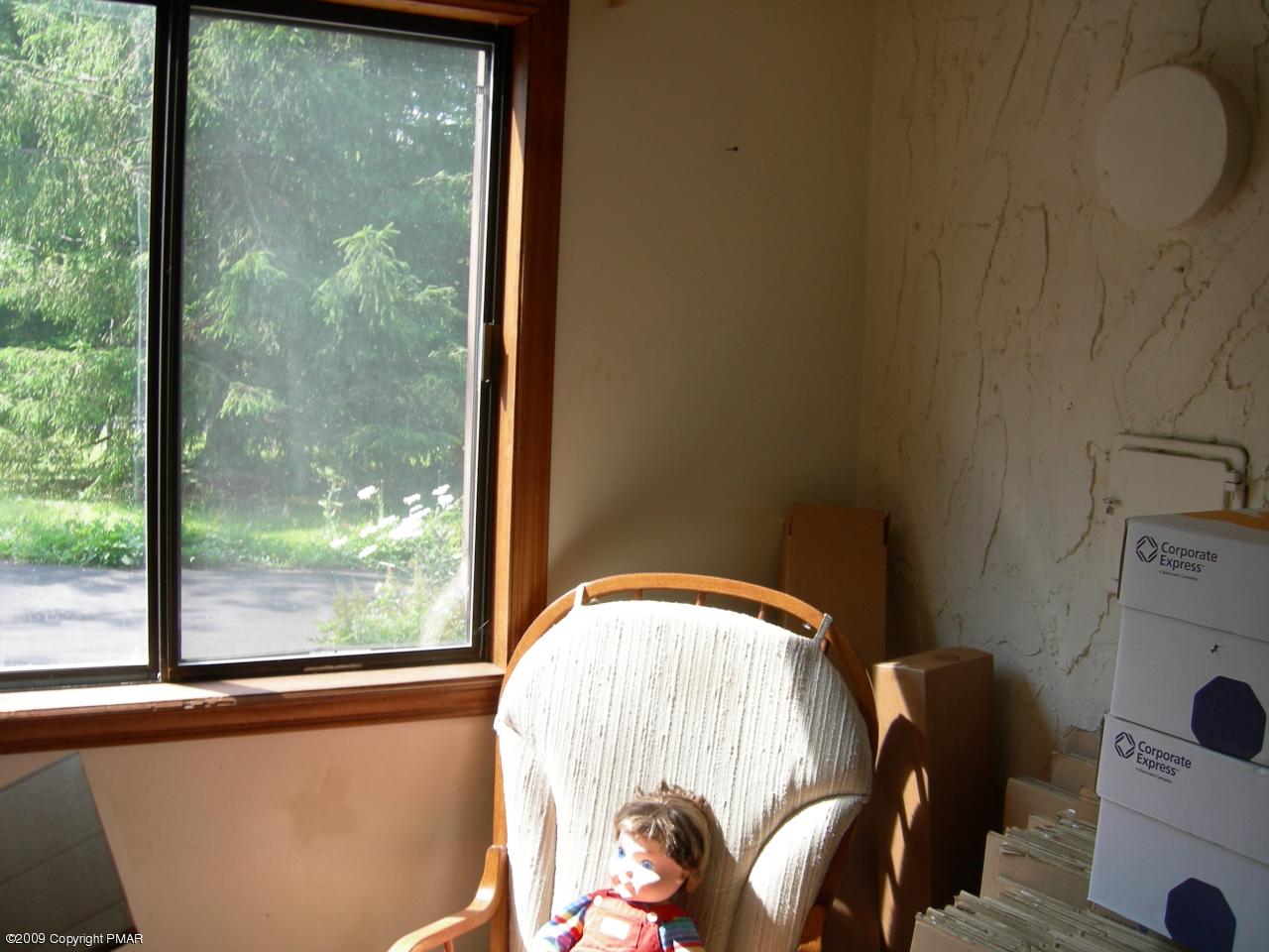 1115 Kilmer Road Tobyhanna, PA 18466 - Photo 8 of 17 a view of a room that has a bed and a window