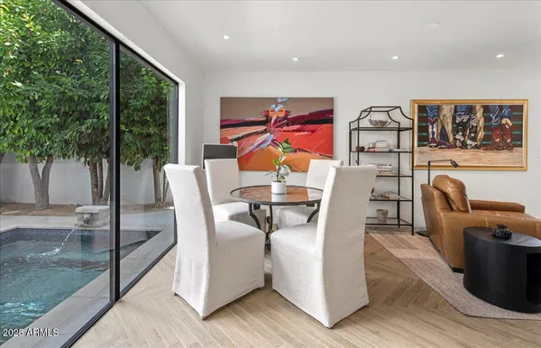 a view of a dining room with furniture window and outside view