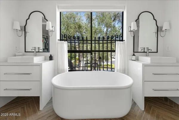 a bathroom with a sink a vanity and a mirror