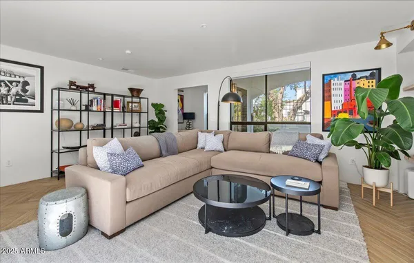 a living room with furniture and a flat screen tv