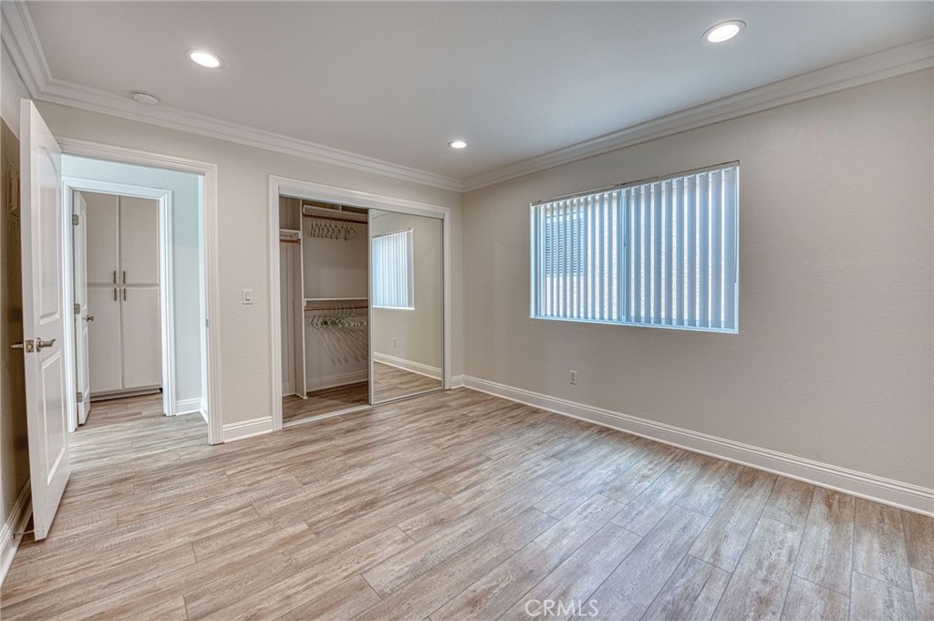 33782 Malaga Drive, Unit C Dana Point, CA 92629 - Photo 6 of 11 an empty room with wooden floor and windows