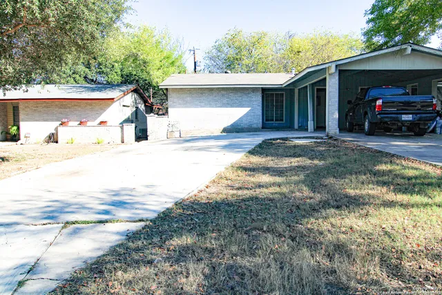 a view of a house with a street