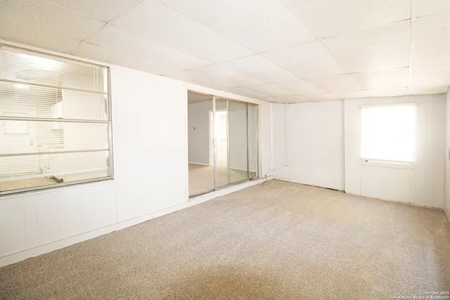 an empty room with a empty space and a window