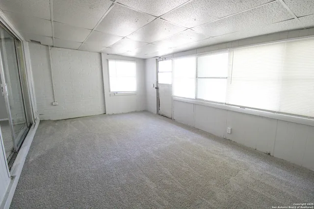 an empty room with windows