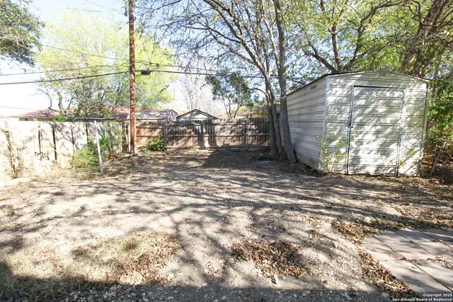 a view of a backyard of the house