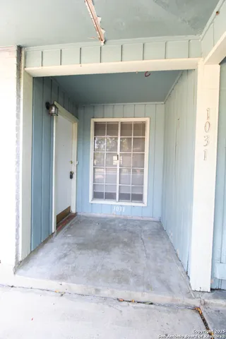 a view of a room with a large window