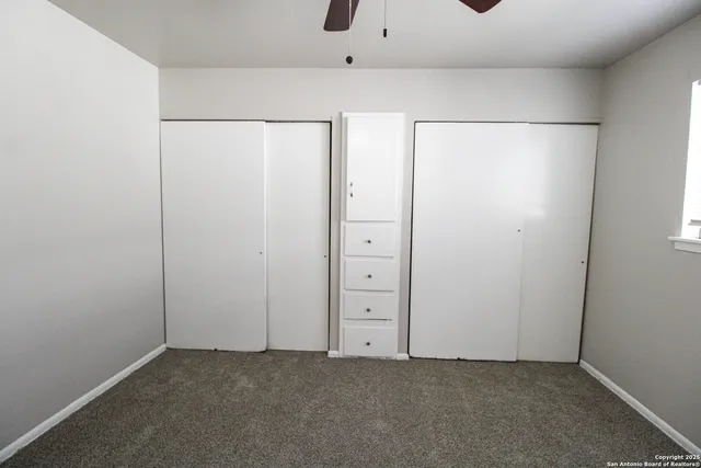 an empty room with closet area