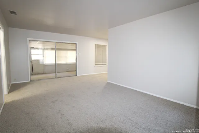 an empty room with windows