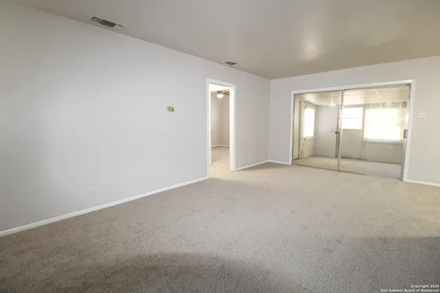 an empty room with windows