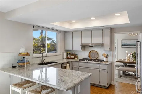a bedroom with furniture and a large window