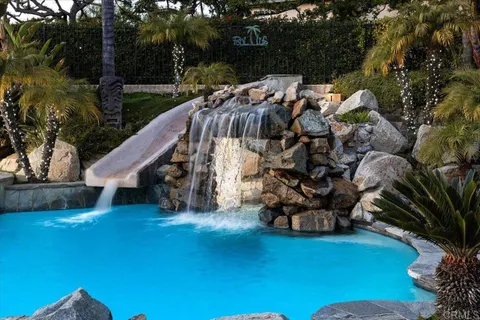 a potted plant is sitting in front of a house