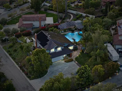 a view of a dining room with furniture wooden floor and chandelier