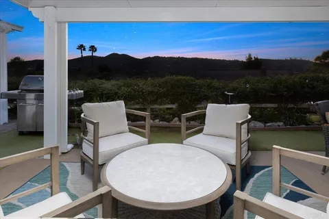 a bedroom with a large bed and a large window