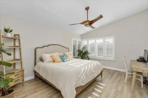 an aerial view of a house with a yard and garden