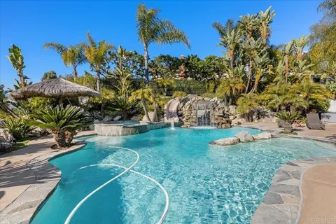 a view of swimming pool with outdoor seating