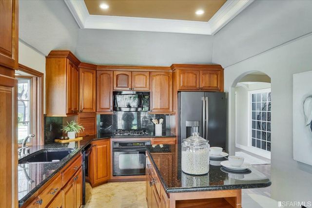 an aerial view of a residential houses with outdoor space and street view