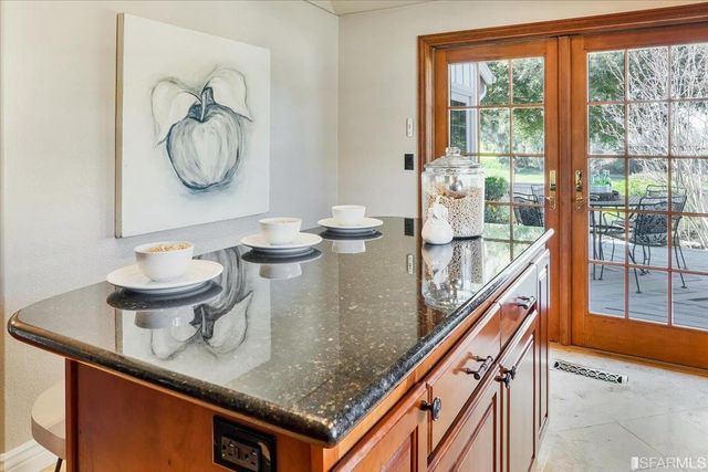 an aerial view of a residential houses with yard