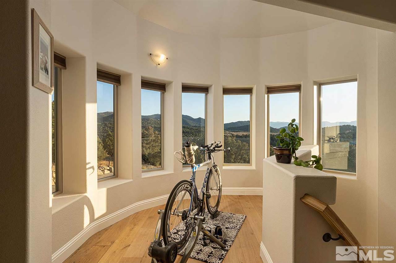2001 Saddleback Road Reno, NV 89521 - Photo 17 of 25 a view of a room with windows and wooden floor