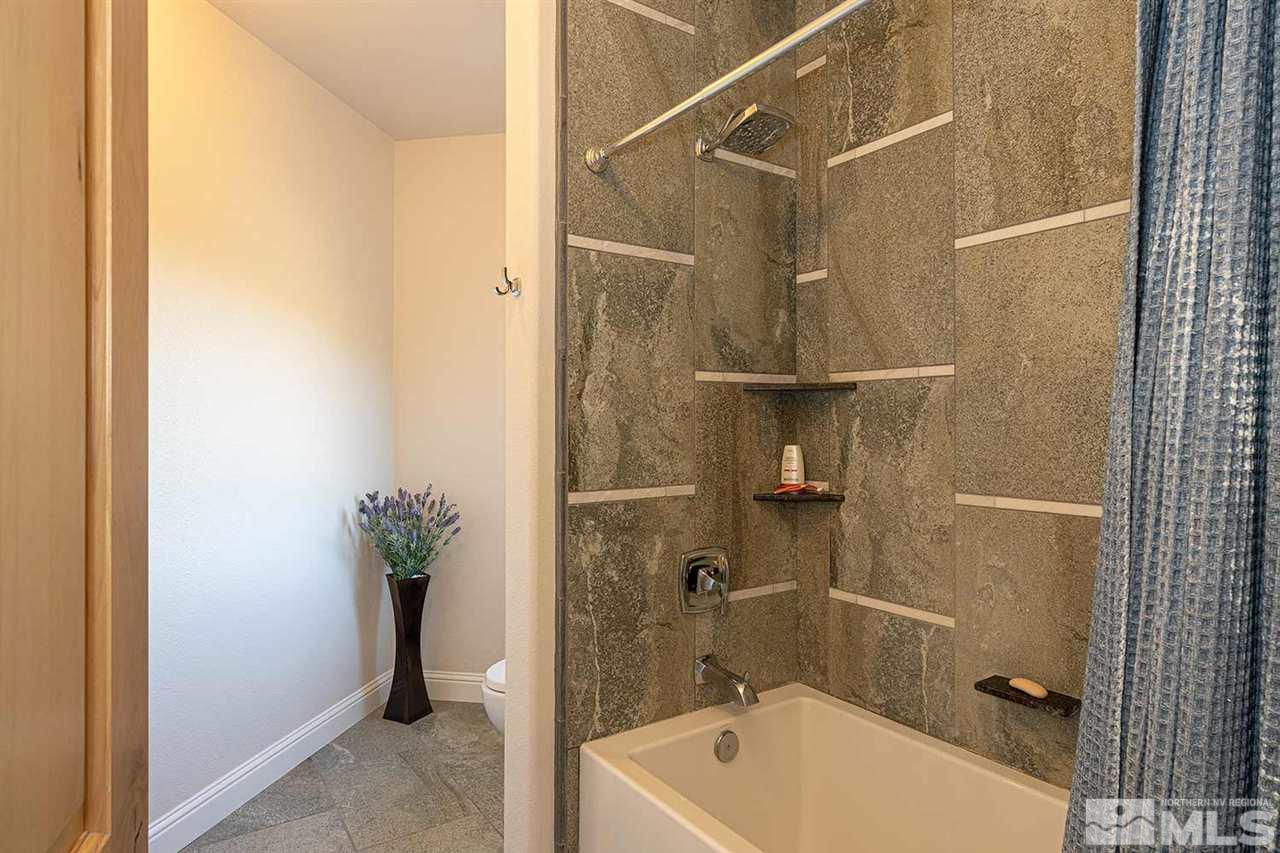 2001 Saddleback Road Reno, NV 89521 - Photo 22 of 25 a bathroom with a tub and shower
