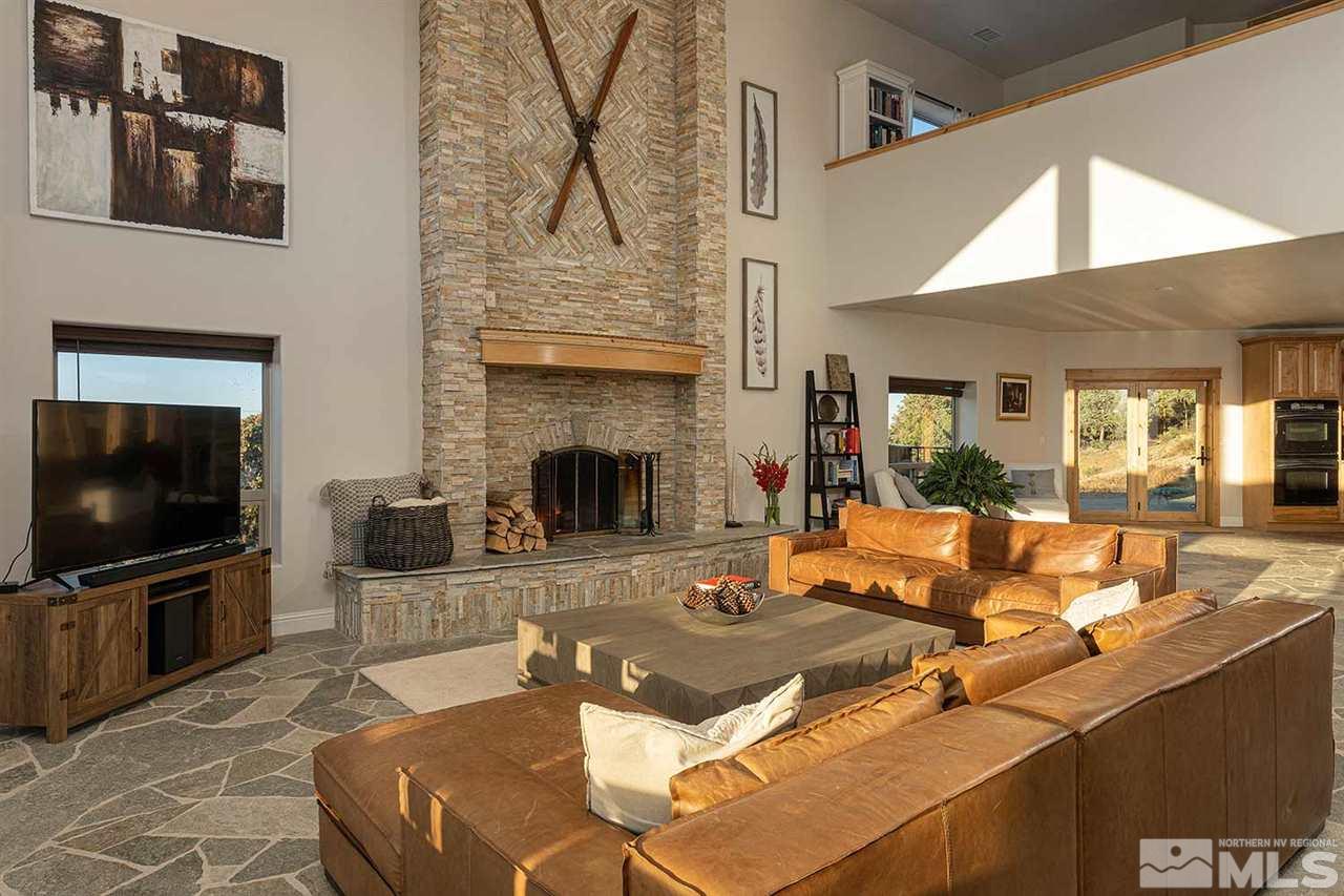 2001 Saddleback Road Reno, NV 89521 - Photo 6 of 25 a living room with furniture a flat screen tv and a fireplace