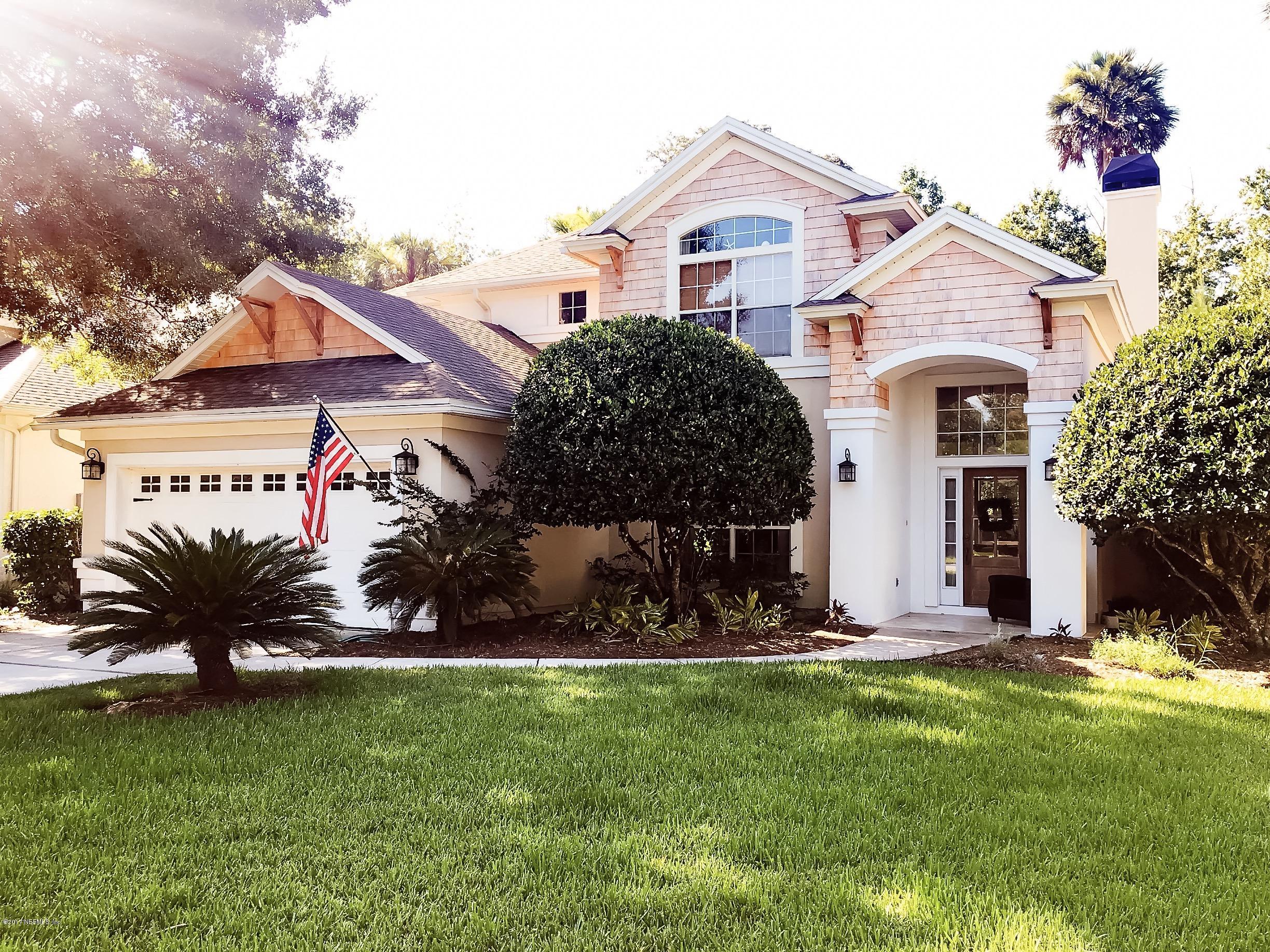 453 Big Tree Road Ponte Vedra Beach, FL 32082 - Photo 1 of 17 a front view of a house with a garden and plants