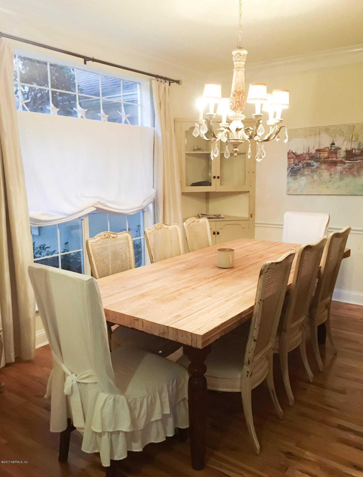 453 Big Tree Road Ponte Vedra Beach, FL 32082 - Photo 7 of 17 a dining room with furniture and chandelier