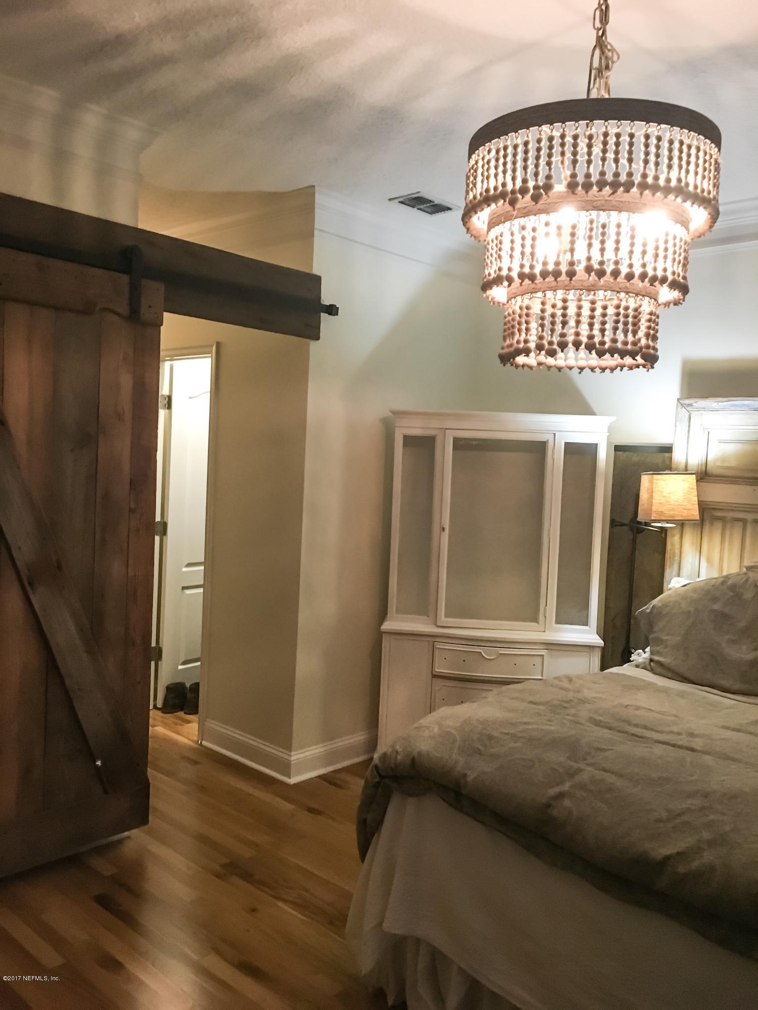 453 Big Tree Road Ponte Vedra Beach, FL 32082 - Photo 9 of 17 a bedroom with a bed and a window