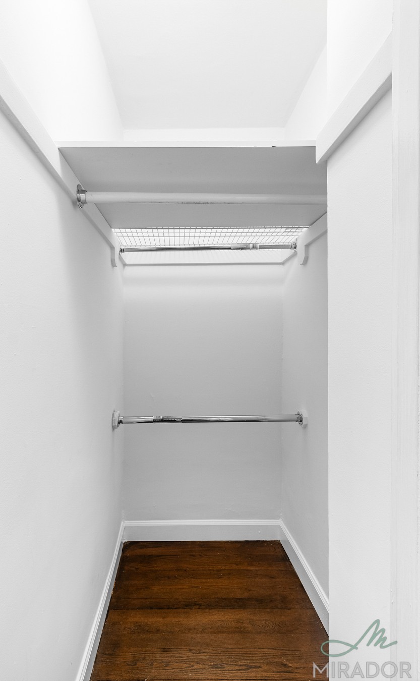 39 West 16th Street, Unit 5F Manhattan, NY 10011 - Photo 5 of 11 a view of a room with empty racks