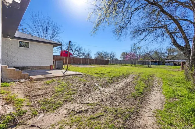 a view of a playground with a yard