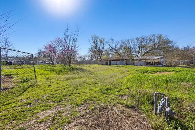 a swimming pool with an outdoor space and seating area