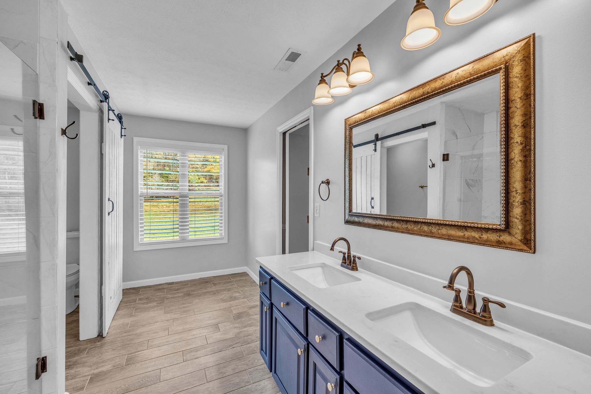 240 Scenic Drive Pulaski, TN 38478 - Photo 16 of 45 a bathroom with 2 sink and a mirror
