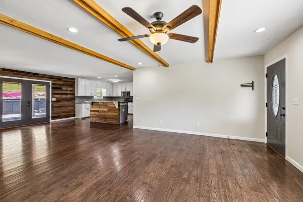 a aerial view of a house with swimming pool and a yard