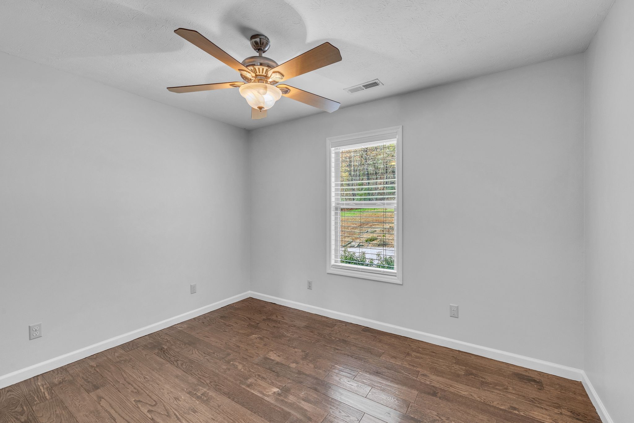 240 Scenic Drive Pulaski, TN 38478 - Photo 35 of 67 an empty room with window and ceiling fan