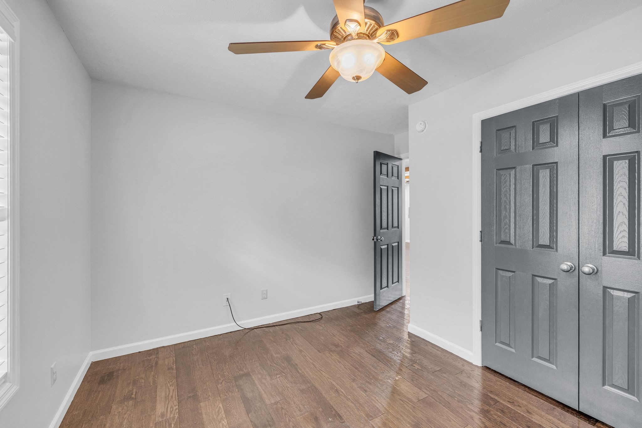 240 Scenic Drive Pulaski, TN 38478 - Photo 36 of 67 an empty room with wooden floor closet and fan