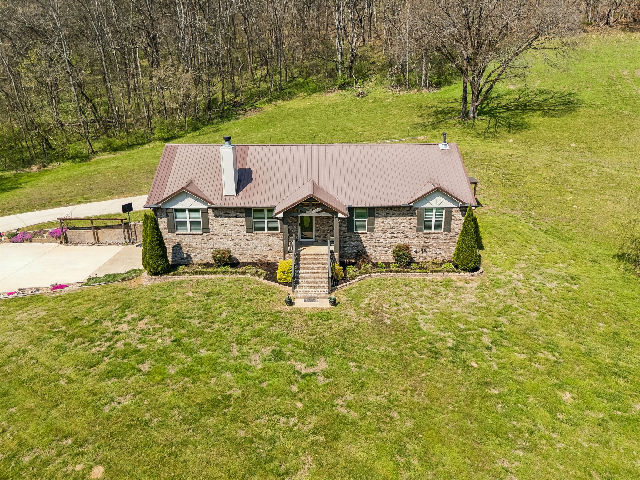 240 Scenic Drive Pulaski, TN 38478 - Photo 61 of 67 a front view of a house with garden