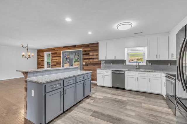 a bathroom with 2 sink and a mirror