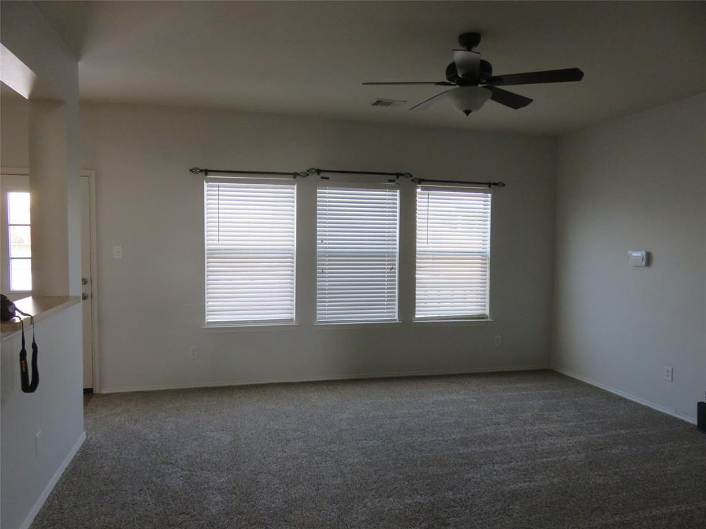 2026 Tanur Cascade Drive Anna, TX 75409 - Photo 16 of 24 an empty room with a empty space and windows