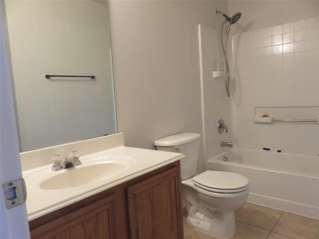 2026 Tanur Cascade Drive Anna, TX 75409 - Photo 20 of 24 a bathroom with a sink a toilet and shower