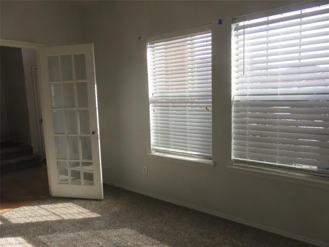 a view of a room that has a window in it