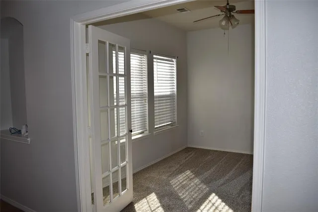 a view of an empty room with a window
