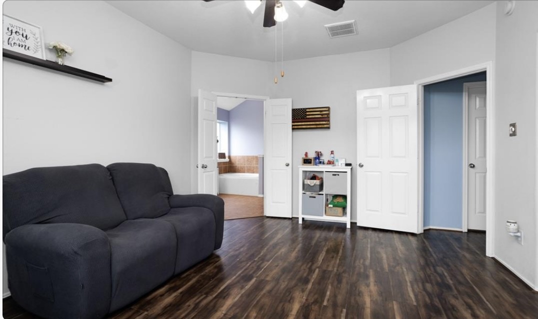 5015 Bridgecrossing Court Spring, TX 77379 - Photo 11 of 12 a living room with furniture and wooden floor