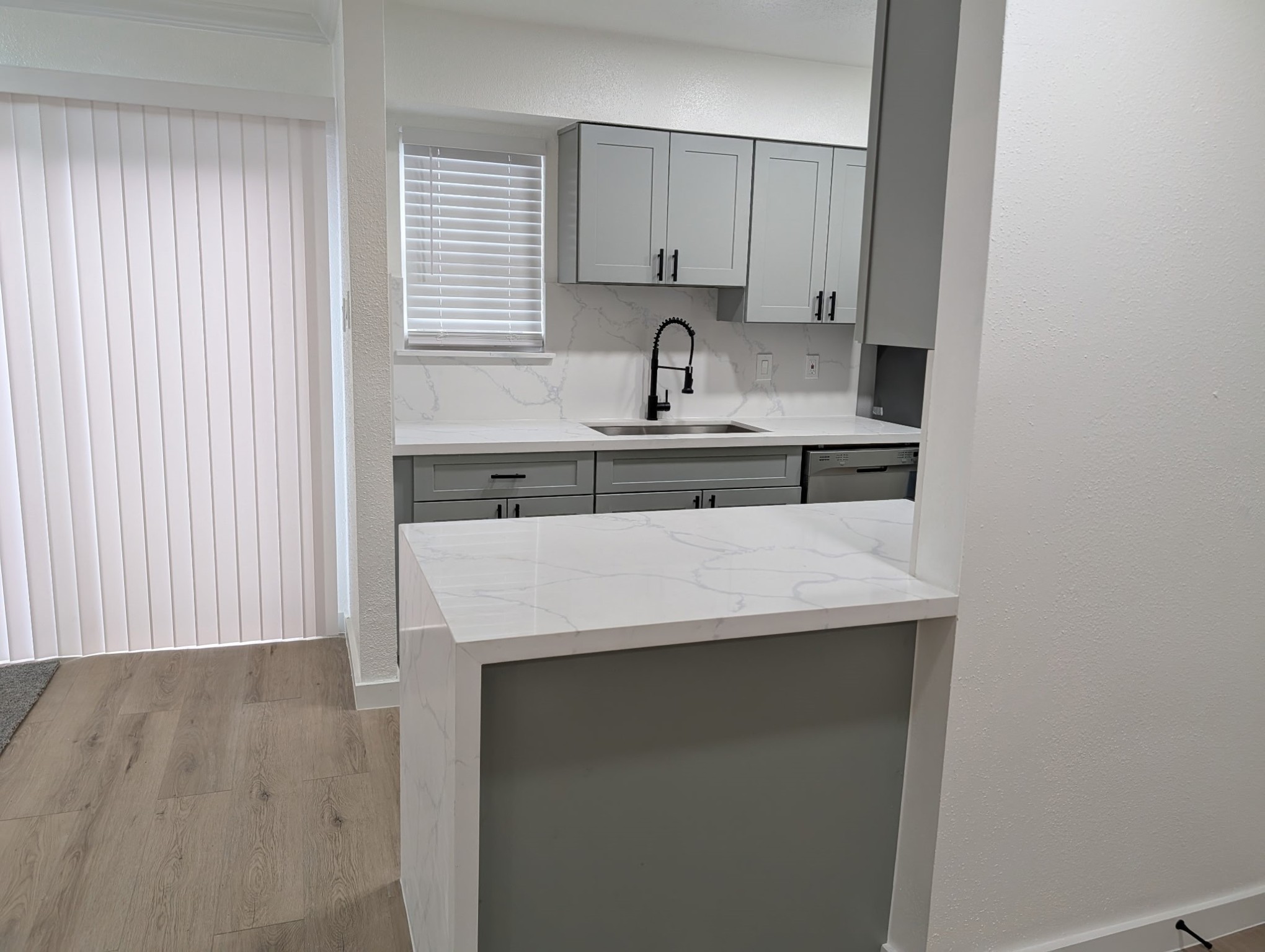 6001 Reims Road, Unit 1412 Houston, TX 77036 - Photo 20 of 28 a kitchen with a sink a stove and cabinets