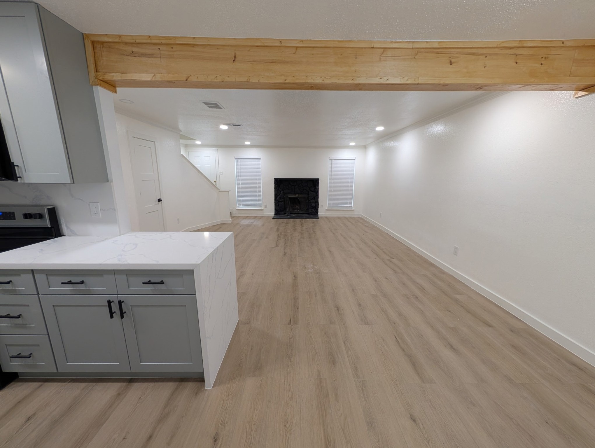 6001 Reims Road, Unit 1412 Houston, TX 77036 - Photo 22 of 28 a view of a hallway with a kitchen